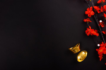 Chinese New Year, flat lay top view, gold bar and Chinese Flower