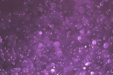 Abstract bokeh lights with light purple background