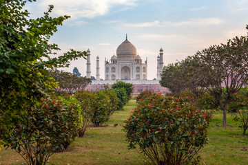 Sunrise at the wonderful Taj Mahal, in Agra, one of the seven world wonder. Giant mausoleum made of...
