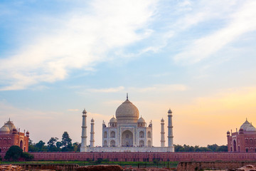 Fototapeta na wymiar Sunset over the wonderful Taj Mahal, in Agra, one of the seven world wonder. Giant mausoleum made of marble.