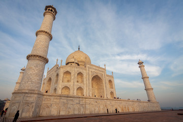 Fototapeta premium Sunrise at the wonderful Taj Mahal, in Agra, one of the seven world wonder. Giant mausoleum made of marble.