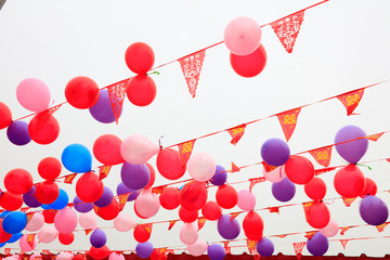 Festive balloons and coloured flags