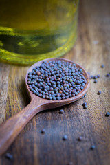 Mustard Seeds and oil bottle