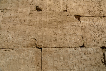 Egyptian ancient hieroglyphs on the stone wall