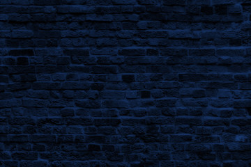 Wall of Classic Blue Bricks in Color 2020. Navy Brick Banner for Web With Textured Blue Surface. Luxury Facade or Face Wall in New Year Trend Color.