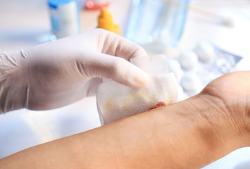 Doctor hand bandage wound for healing from accident 