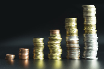 Ladder pile of money or coins suggesting business growth