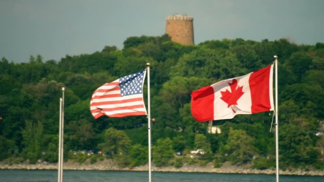 United States of America & Canadian Flags Waving in Slow Motion