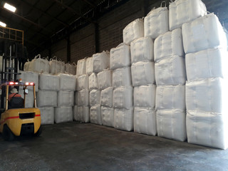 Chemical fertilizer Urea Stock pile jumbo-bag in warehouse waiting for shipment.