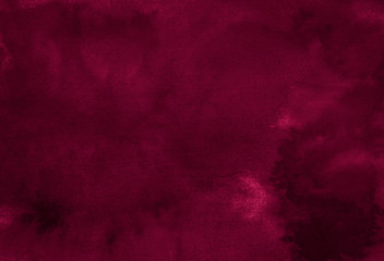Dark saturated burgundy watercolor background with torn strokes and uneven spots. Trend color texture. Abstract background for design, layouts and patterns.