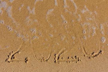 New year 2020. Inscription on a sandy beach. Tropical celebration concept