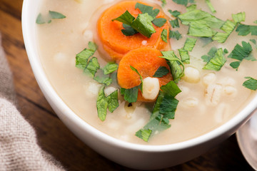Barley soup, pearl barley in white bowl