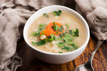 Barley soup, pearl barley in white bowl