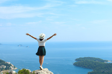 man on a rock in summer inspired by sea view