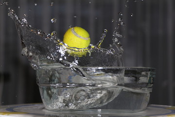 Dance of a tennis ball in harmony with water.