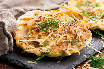 Baked scallops with cheese and spicy sauce. Delicate is a real pleasure.