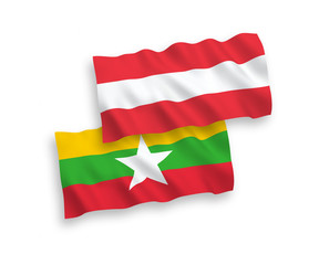 National vector fabric wave flags of Austria and Myanmar isolated on white background. 1 to 2 proportion.