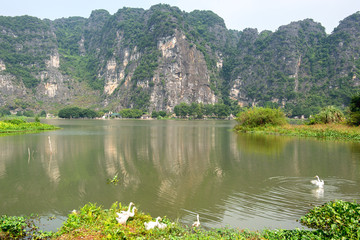 Panoramic view of karst formations  in Tam Coc, a part of Trang An Complex , was declared a UNESCO World Heritage Natural and Cultural Monument.Ninh Binh province, Vietnam