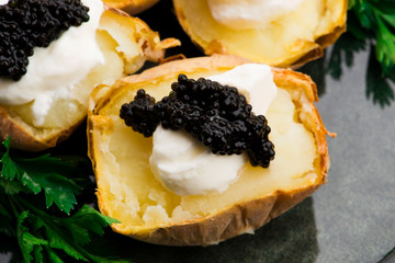 Baked potato with spiced cream cheese and caviar
