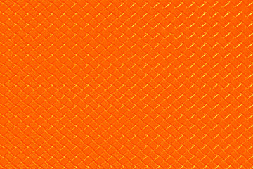 Bright orange leather background with imitation weave texture. Glossy dermantine, artificial leather structure. Fake woven leather wicker textured surface.