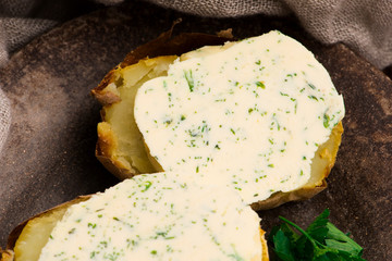 Baked potatoes with herbs butter