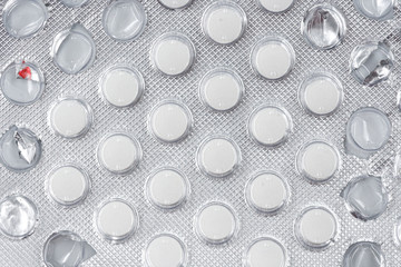 Pills in pack isolated on white background. close-up