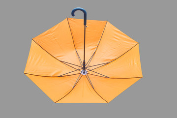 Open umbrella isolated on gray background.