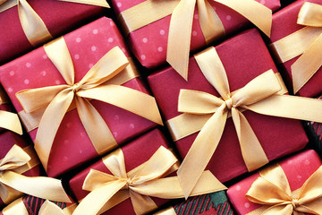 Gift present boxes background; festive Christmas and New Year celebration card, toned image, selective focus
