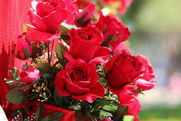Red plastic  roses flowers decoration for concepts Valentine, romantic and beautiful backdrop