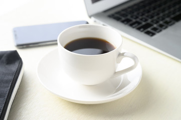 Obraz na płótnie Canvas caffee and caffee cup and laptop pc and smartphone