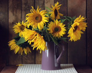 yellow sunflowers in a jug.