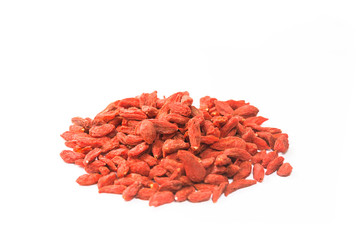 Spread out goji berries on a white background.