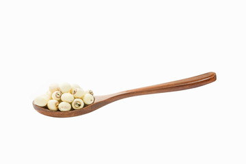 A wooden spoon scoop of lotus seeds is placed on a white background.