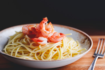 Fried shrimps on the pasta. The concept of dinner or lunch with seafood.