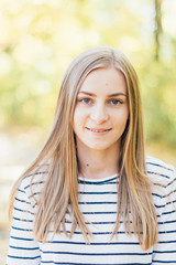 Portrait of young beautiful happy woman, autumn outdoors