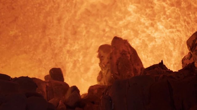Aluminium foundry furnace loaded with metal. Red hot flames glowing and liquid melting. Fire melts aluminum ingots in a blast furnace.
