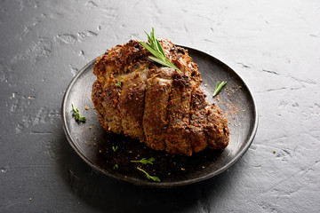 Barbecue meat. Grilled beef on plate over black stone background. Top view, flat lay