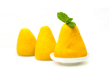 Wuwutou on a white background, dotted with a mint leaf.