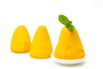 Wuwutou on a white background, dotted with a mint leaf.