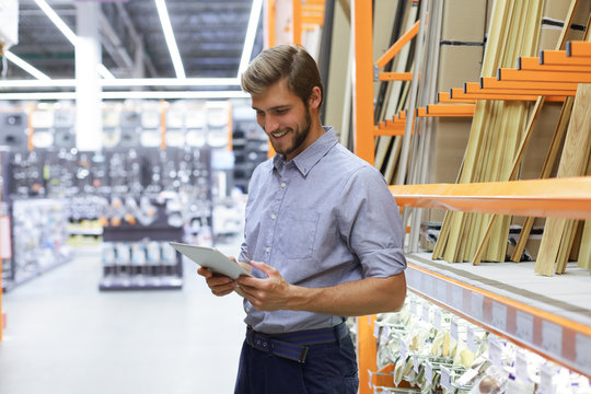 Manager Use His Tablet For Online Checking Products Available.