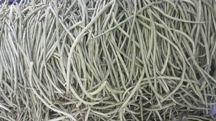 selling fresh organic cowpea in the market