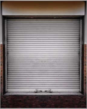 Steel shutter door of warehouse, storage or storefront for metal door background and textured.	