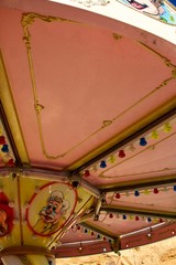  vintage carousel at the fair against the blue sky