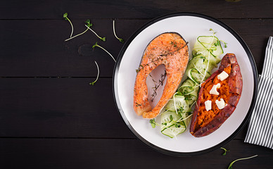 Healthy food: baked salmon and sweet potato and vegetables. Top view , overhead. Diet menu. Copy space