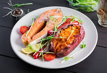 Healthy food: baked salmon and sweet potato and vegetables. Diet menu.