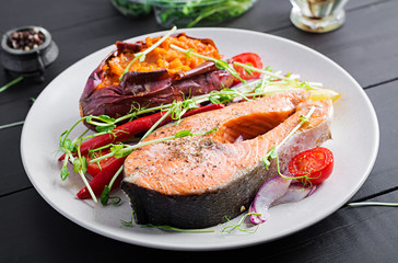 Healthy food: baked salmon and sweet potato and vegetables. Diet menu.
