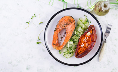 Healthy food: baked salmon and sweet potato and vegetables. Top view , overhead. Diet menu. Copy space