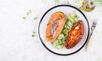 Healthy food: baked salmon and sweet potato and vegetables. Top view , overhead. Diet menu. Copy space