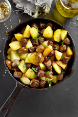 Fried potatoes with mushroom and sausage