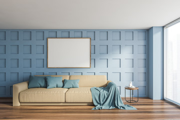 Blue living room with beige sofa and mockup poster